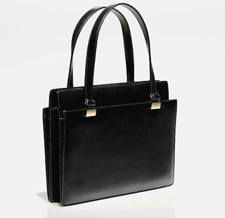 Illustration for article titled Margaret Thatcher's Handbag Is A Powerful Thing
